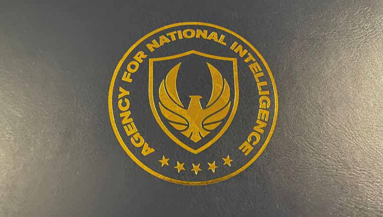 Picture of the folder front. Showing a golden logo with Agency for National Intelligence on a blue leather file
