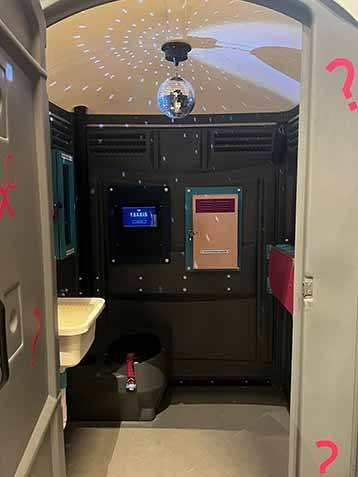 imagine inside the turdis. It looks like a portaloo, but has a disco ball at the top, and is very clean